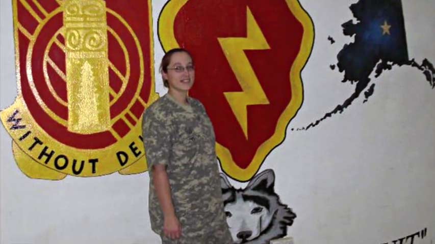 U.S. Army Specialist Amanda Tyson and Service K9 Barrett